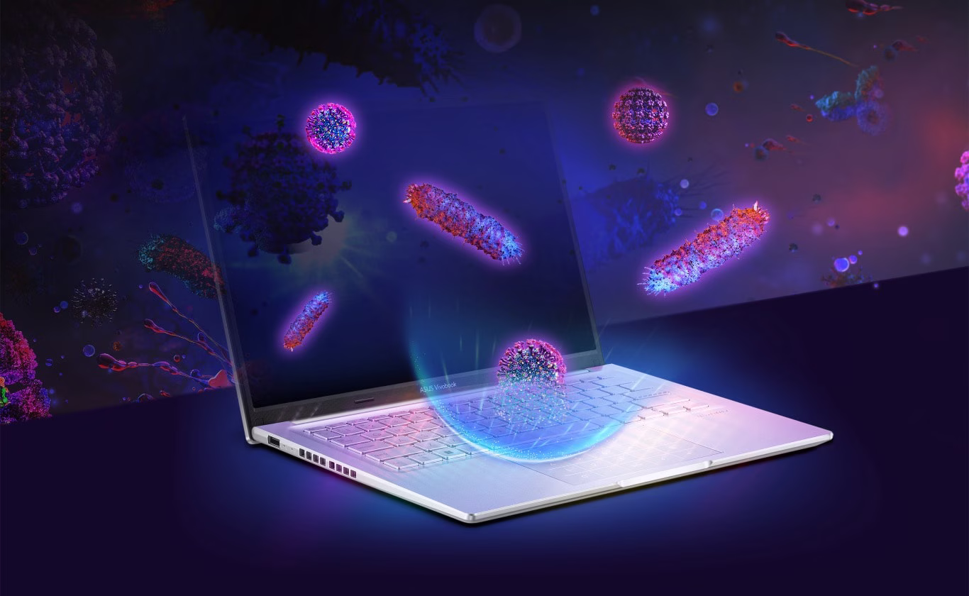3D-billeder af vira og bakterier, der &oslash;del&aelig;gges ved kontakt med tastaturet p&aring; en b&aelig;rbar computer, der er behandlet med ASUS Antimicrobial Technology.