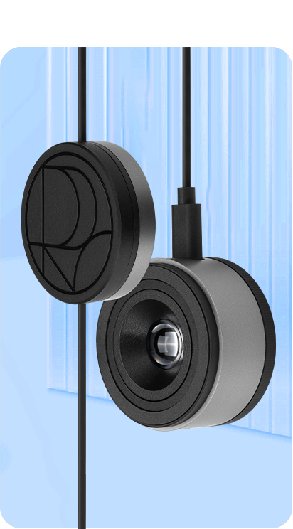 Shows ProArt CaliContrO's colorimeter lens and counterweight.