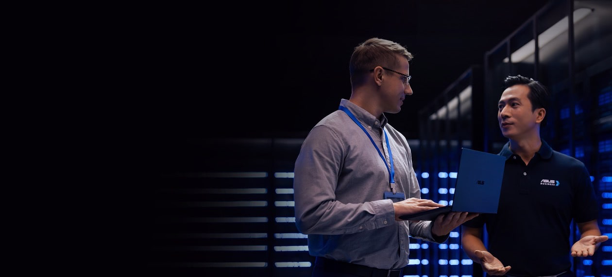 Two men talking in a server room 