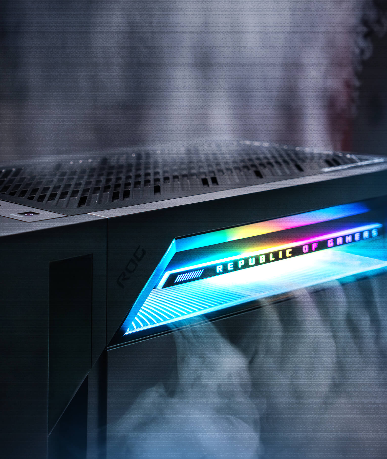 The ROG G1000 features the ROG Thermal Atrium pulling air in from the outside and releasing it through the top, with futuristic RGB lighting illuminating the upper panel.