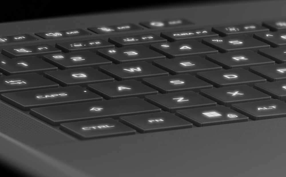 Extreme close up of the WASD keys on the Eclipse Grey Zephyrus G14, with the keys illuminated in blue.