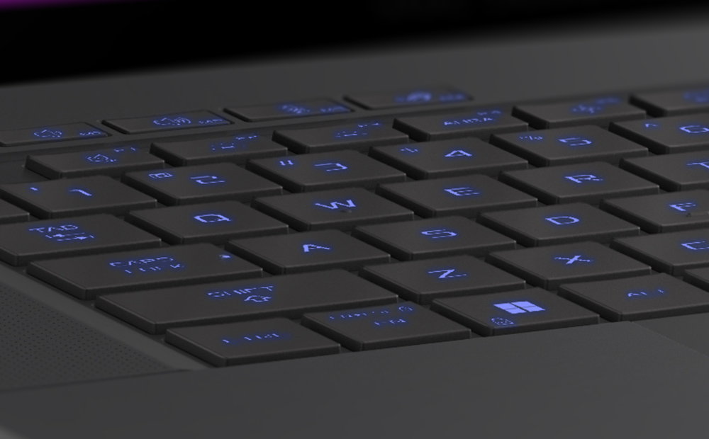 Extreme close up of the WASD keys on the Eclipse Grey Zephyrus G14, with the keys illuminated in blue.