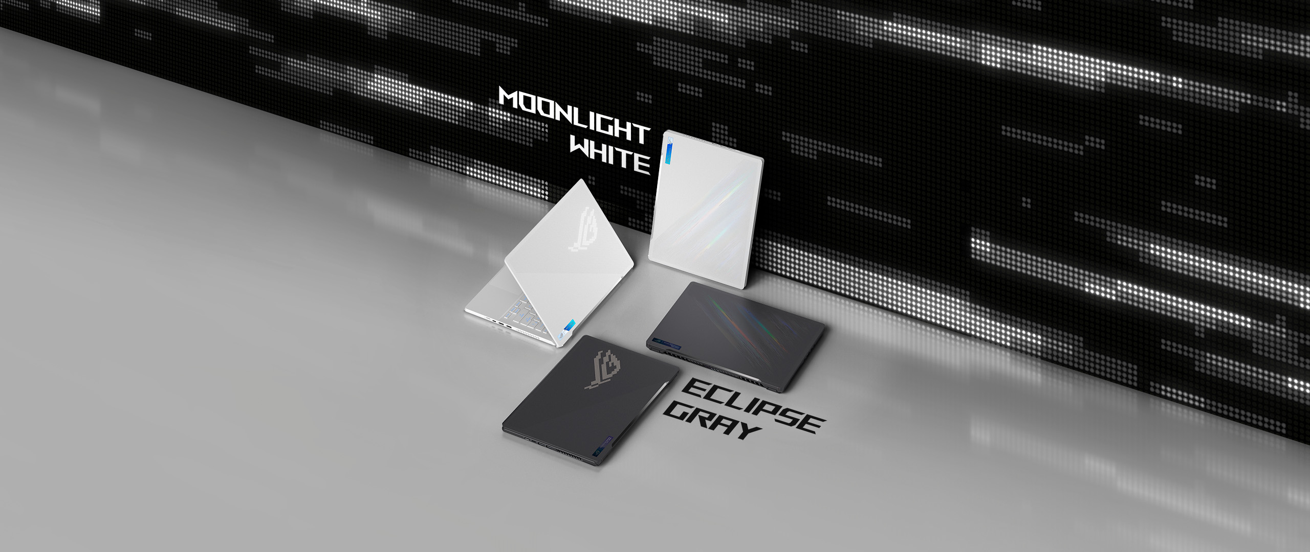 Two Eclipse Gray and two Moonlight White Zephyrus G14’s, arranged to show the color and lid design options