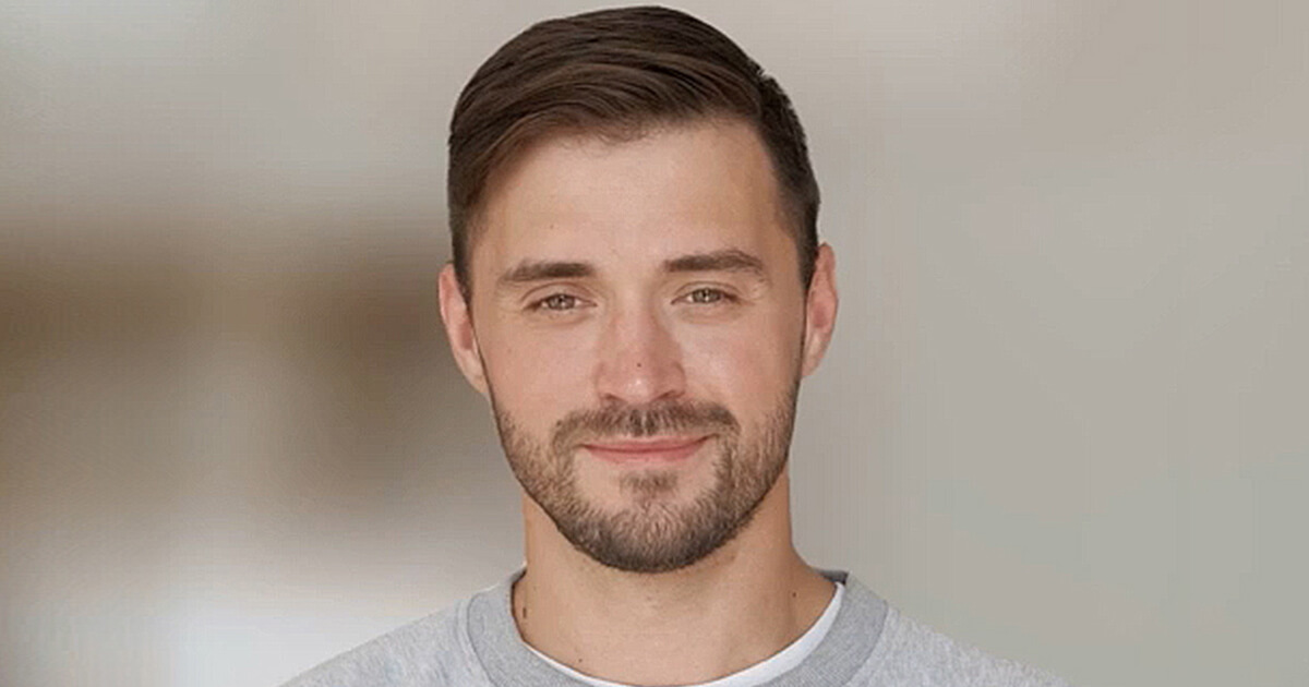 An image of a man with a blurred background.