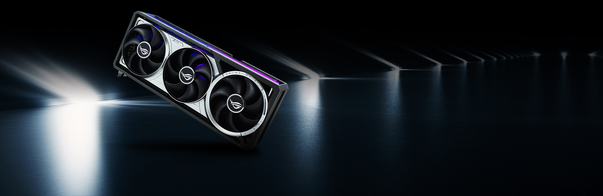 An ROG graphics card with a silver surface in the background.