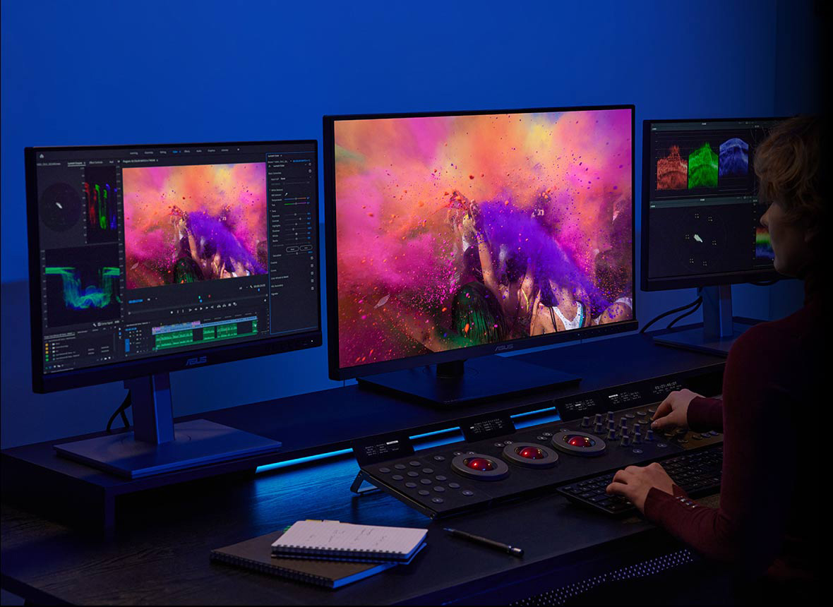A creator grading colors on ProArt Display PA27DCE.